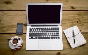 laptop, phone, cup of coffee