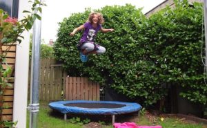 girl jumping on trampoline