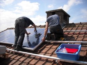 men setting solar